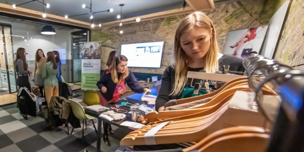 Sustainable Styling Workshop with personal stylist and sustainable style expert, Roberta Lee. EBD Team member Amelie, Personal Shopping and exploring pre-loved clothes hanging on a clothing rail in London.
