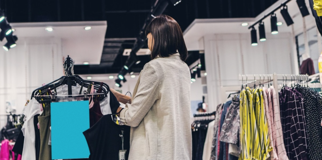 Woman shopping for highstreet brands | buying fast fashion