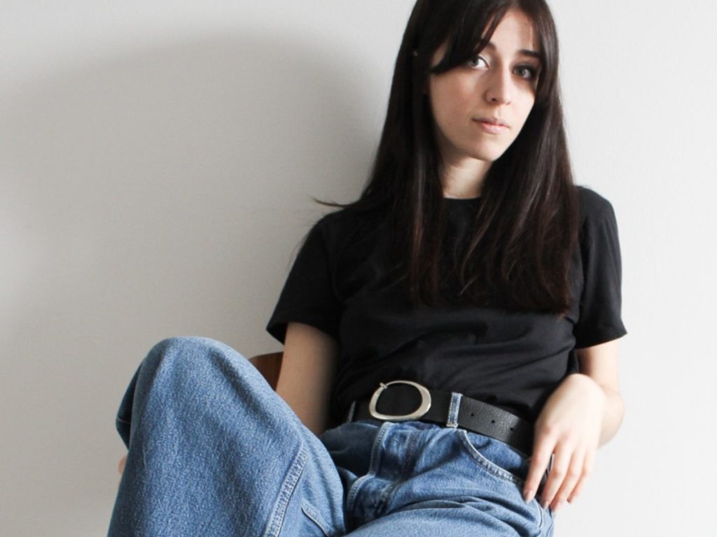 Besma Whayeb Interview | Black t-shirt and blue jeans outfit