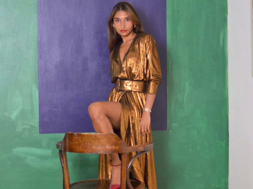 Eshita Kabra wearing gold maxi dress with red heels | Style Stories Interview