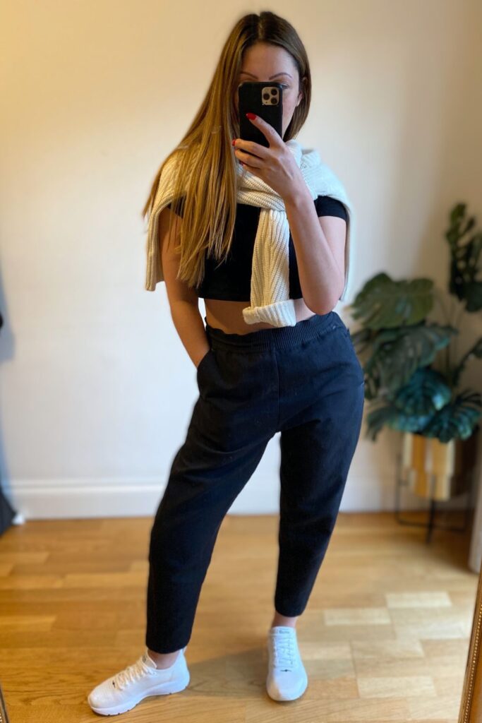 casual and chic weekend outfit wearing mens joggers. Black, white and cream outfit. 