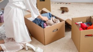 Wardrobe Audit | Woman sorting clothes out