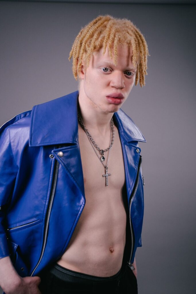 Up and coming model Shem from Zebedee for New Model Army series wearing blue biker jacket
