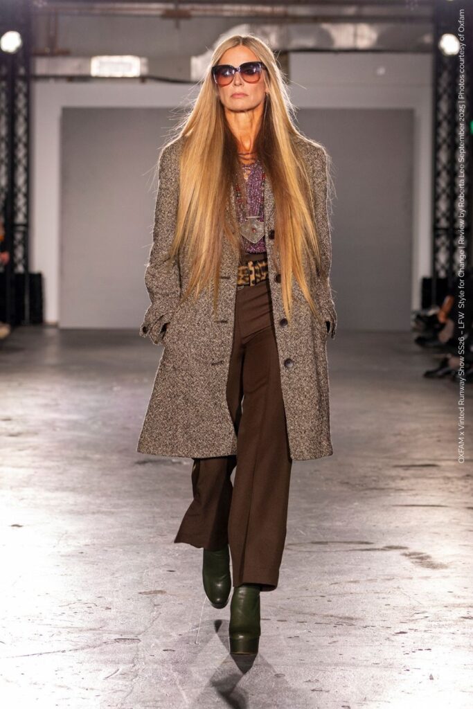 Laura Bailey in 70s inspired look tweed coat with brown trousers and a platform combo. Oxfam x Vinted Runway Show LFW SS26.